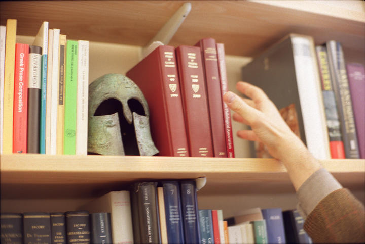 bookshelf with helmet and books